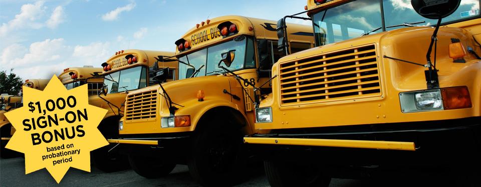 Front of a line of school buses; $1,000 Sign-on bonus based on probationary period